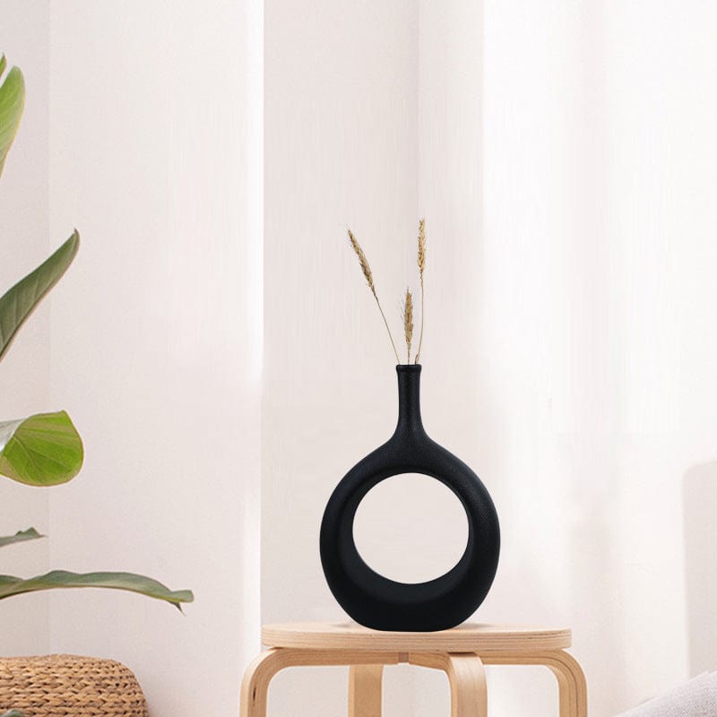 Vase déco ajouré en céramique – Design ovale sculptural noir et blanc